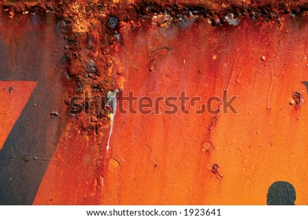Rusting Red and orange painted metal surface.