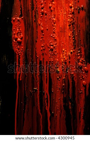 Image of blood and guts splattered against a black surface.  Background image for horror / halloween, etc.
