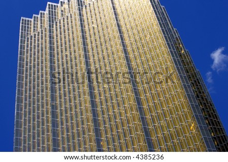 Corporate building with mirrored gold-tinted windows.