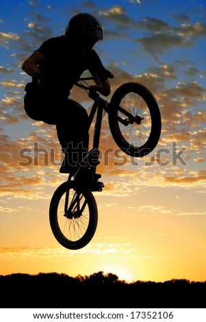 BMX bike high up in the air.