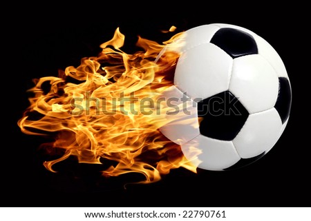 An image of a leather soccer ball in flames soaring through the air.