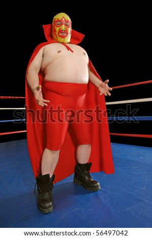 Photograph of a Mexican wrestler or Luchador standing in a wrestling ring.