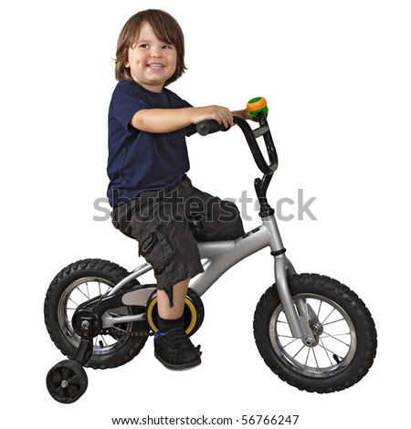 An adorable 3-year-old riding his bicycle fitted with training wheels.