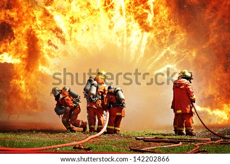Firefighters fighting fire during training