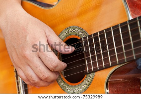classical guitar with hand