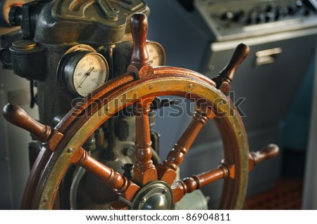 wood steering wheel in big ship