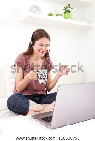 Young woman chatting on internet and having fun