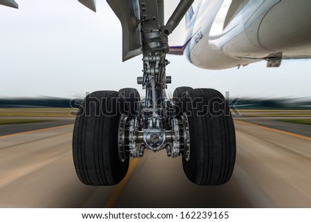 Airplane wheel in a landing gear with motion blur