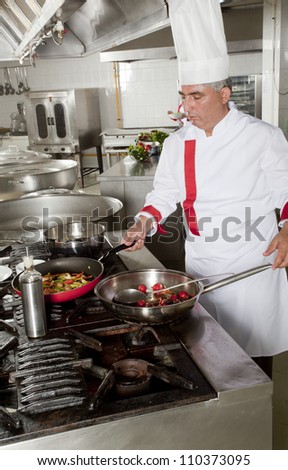 portrait of male chef in kitchen