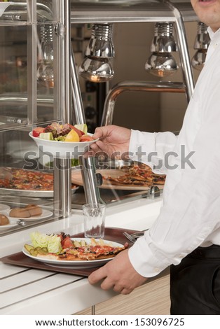 buffet self-service food display human hand take plate
