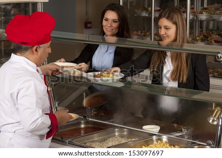 chef standing behind full lunch service station