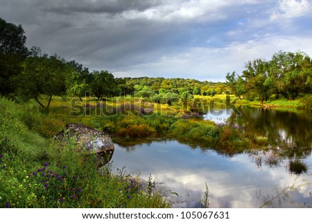 Landscape of beautiful lake and cloudy sky and sunlight in Springtime