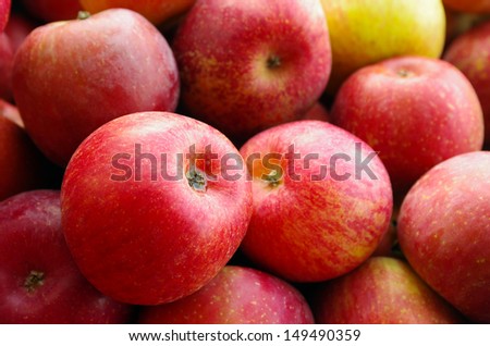 Close-up of pile of red apples for sale in a market