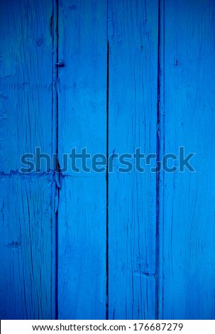 Old and cracked blue painted wooden background