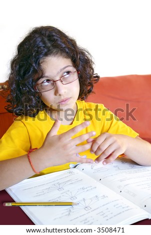 Concentrated young girl doing her school homework