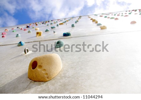 Detail of a climbing wall with a hold in the foreground
