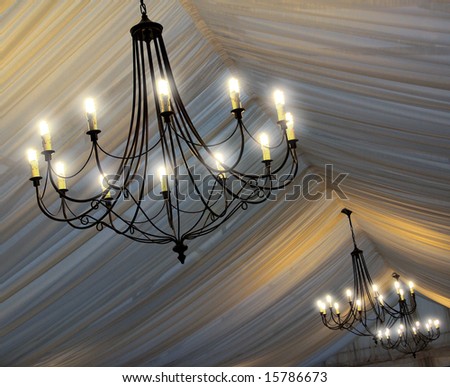 stock photo Photo of chandeliers on an tent's ceiling in a wedding party