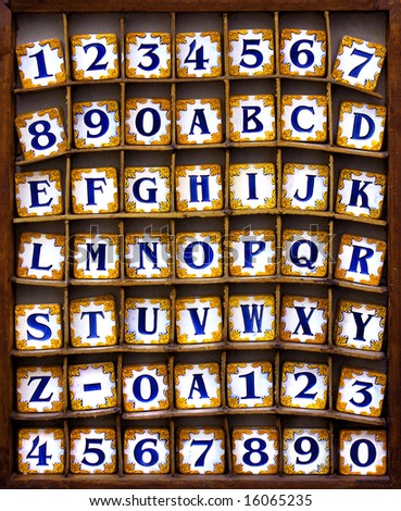 Typical Portuguese porcelain tiles with alphabet and numerals.