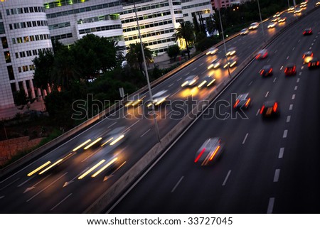 High traffic road with motion blurred automobile in a rush-hour