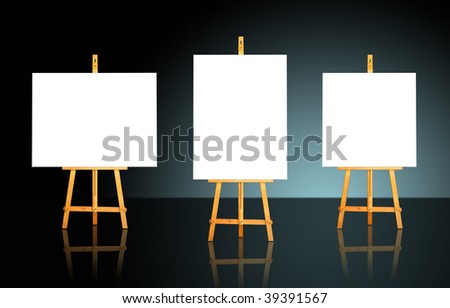 Three blank white canvas on easels over a dark background