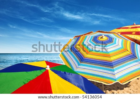 Detail of colorful sunshades in the beach on a sunny summer day