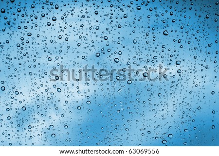Background of water drops on a window glass in a rainy day