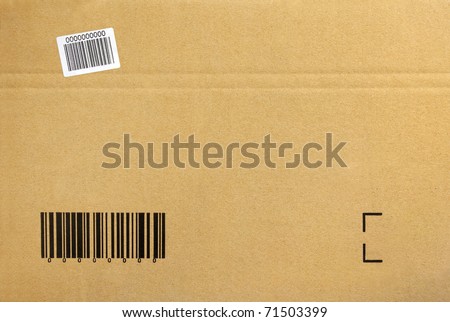 Cardboard background of a closed package box with printed bar-code
