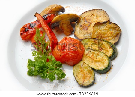 Grilled vegetables are laid out on a plate