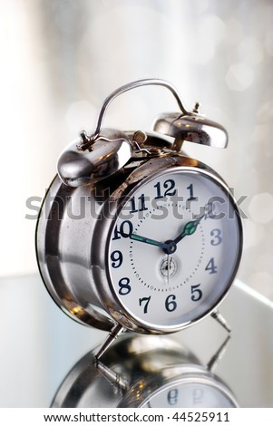 Old fashion alarm clock in the morning light