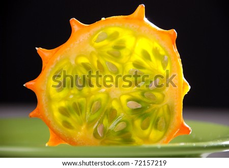 Kiwano or African horned melon . Also known as hedged gourd, African Horned Cucumber, English tomato