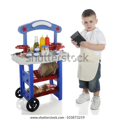An adorable preschooler standing by his hot dog stand calculating the cost of your order.   The stand\'s signs left blank for your text.  On a white background.