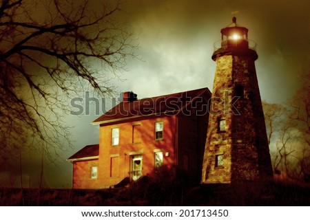 A snowless winter, vintage-style, colored image of a stone lighthouse and brick keeper\'s quarters.