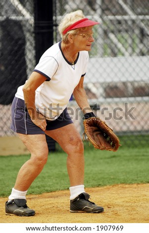 Senior Female Catcher on Softball Team.  With Mitt.