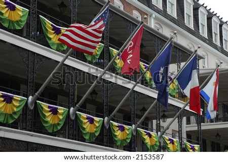 Flags flying on balcony in the French Quarters, New Orleans.