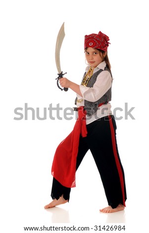 An elementary girl dresses as a pirate looking at the viewer with her sword drawn.  Isolated on white.