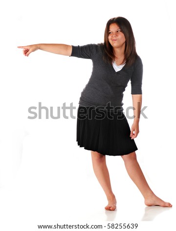 stock photo A barefoot young teen pointing in the distance with a silly