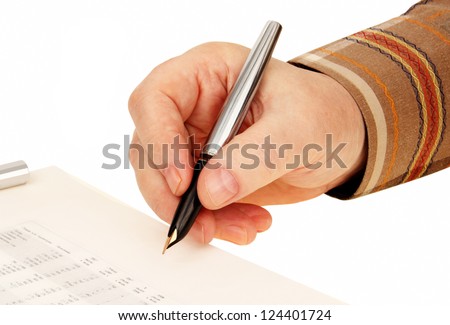 man\'s hand with a gold pen puts his signature on the document. isolated background.