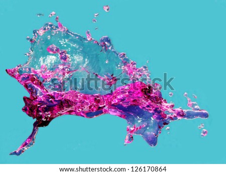 a splash of pink color, photo on a blue background.