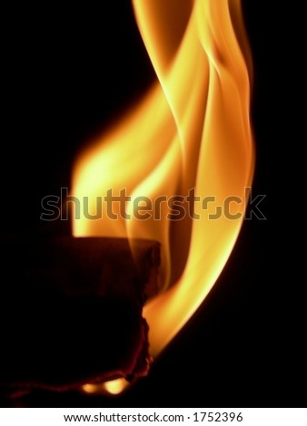 burning paper on black background