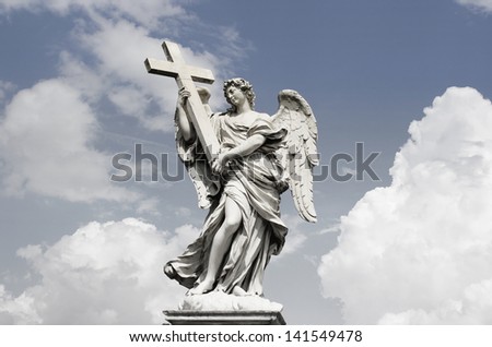 Beautiful Angel sculpture in Rome with an incredible dramatic cloudy sky on the background
