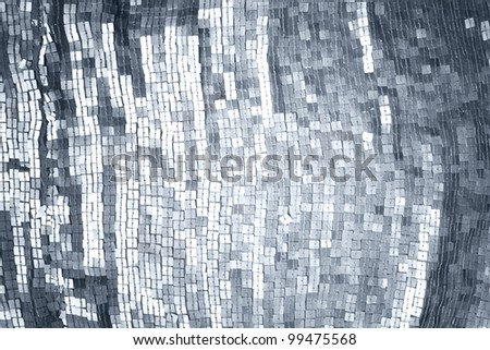 Texture of a fabric of silver sequins