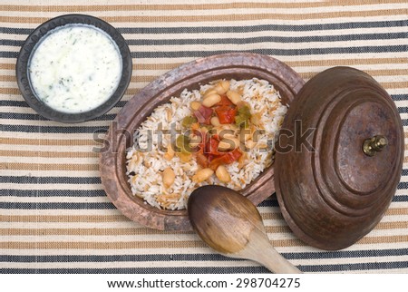 Turkish traditional meal, beans, rice, mixed pickles and tzatziki