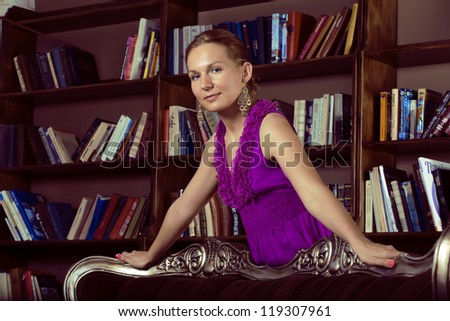 portrait of beauty young woman reading book in library