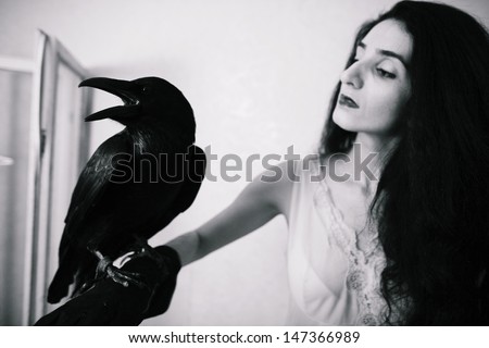 young woman with raven, black and white