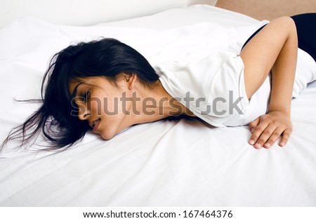 pretty brunette woman in bed, cant sleep