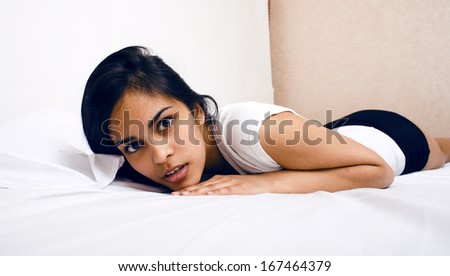 pretty brunette woman in bed, cant sleep