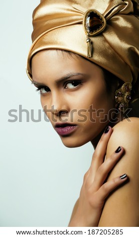 beauty african woman in shawl on head, very elegant look with gold jewelry