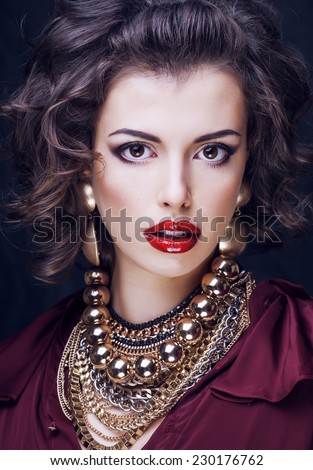 beauty rich brunette woman with a lot of jewellery, hispanic curly lady