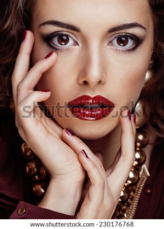 beauty rich brunette woman with a lot of jewellery, hispanic curly lady