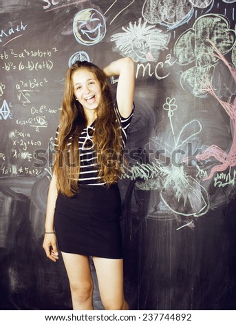 back to school after summer vacations, cute teen real girl in classroom